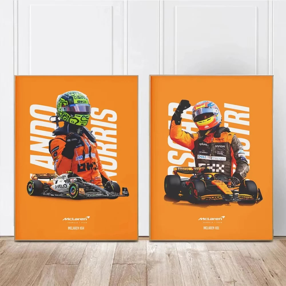 Two orange posters featuring racing drivers and cars on a wooden floor.