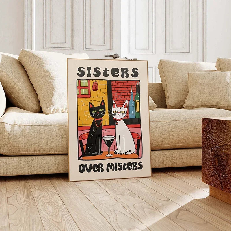 Poster with cats and text 'SISTERS OVER MISTERS' on a wooden floor in a living room.