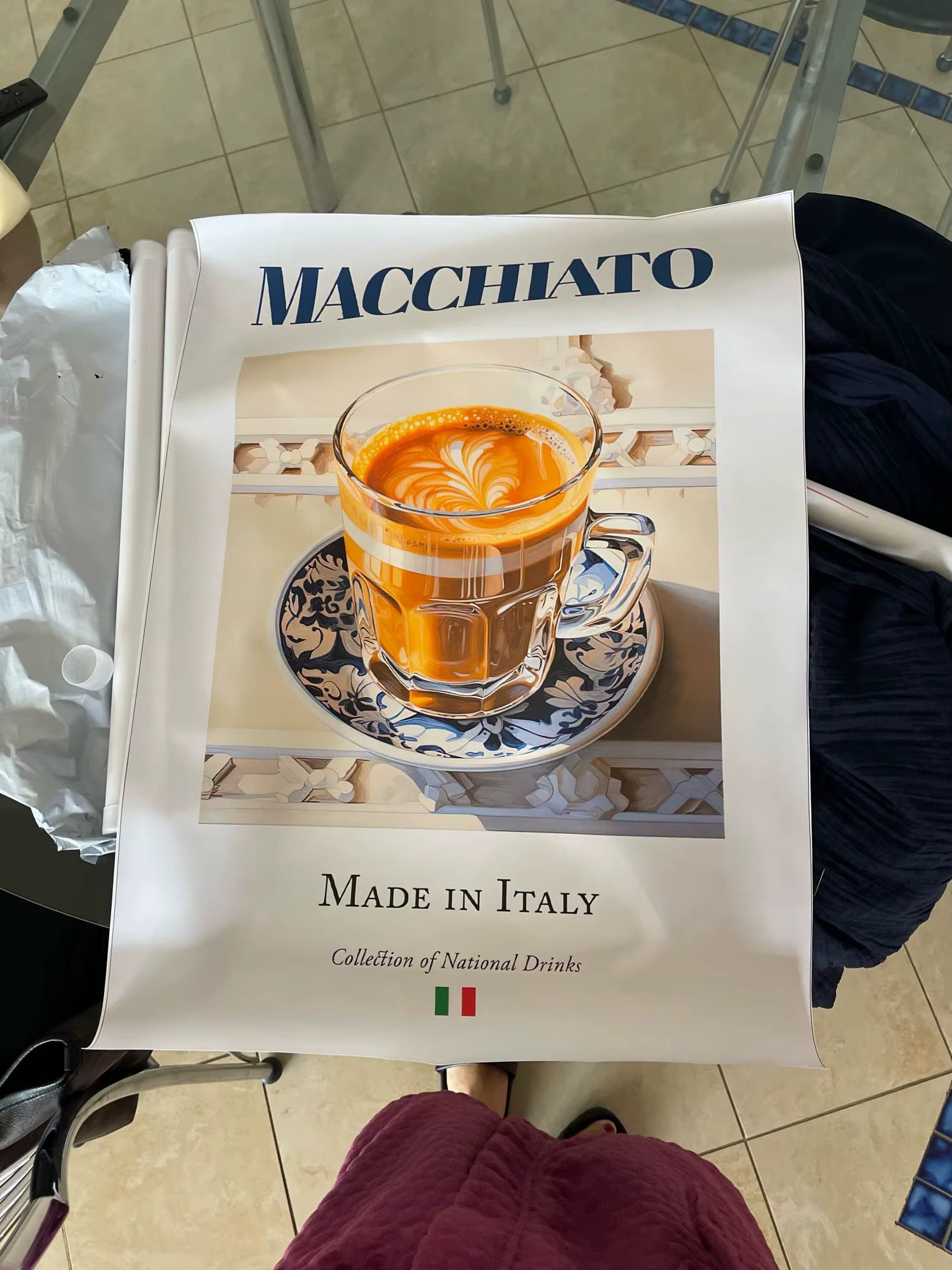Product packaging with a glass of macchiato coffee on a saucer, labeled 'Macchiato Made in Italy'.