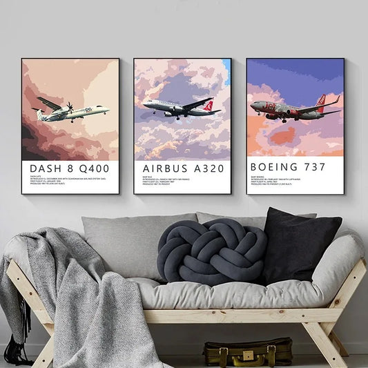 Three airplane posters on a wall above a sofa with decorative pillows. Canvas & Curio
