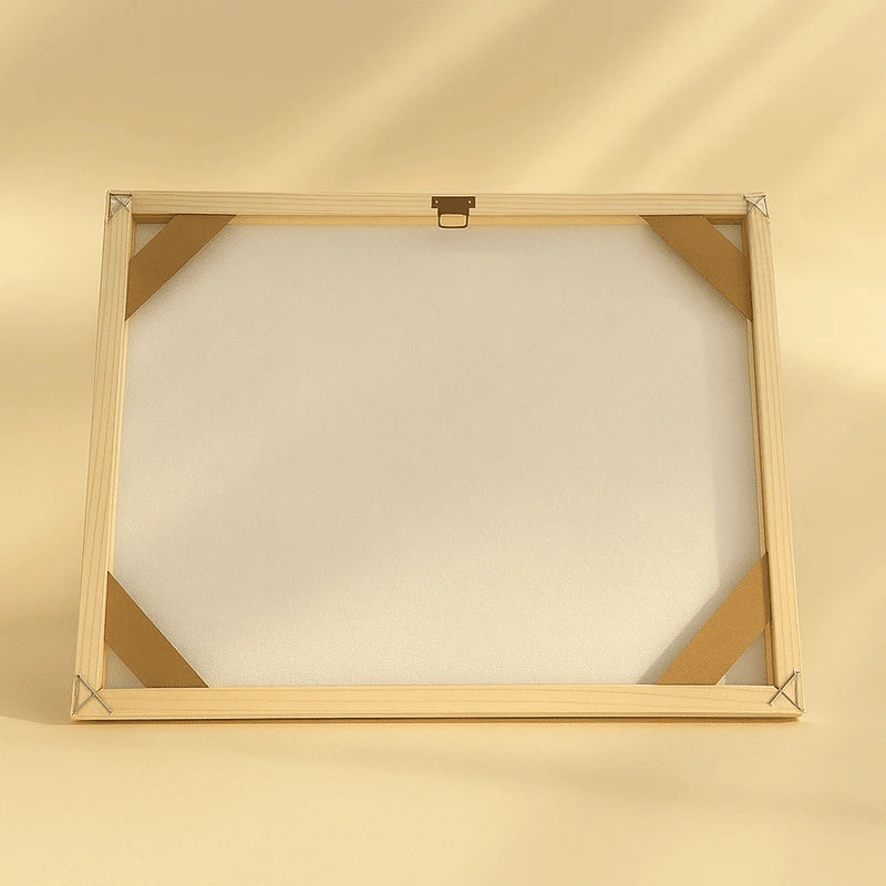 Wooden picture frame on a beige background