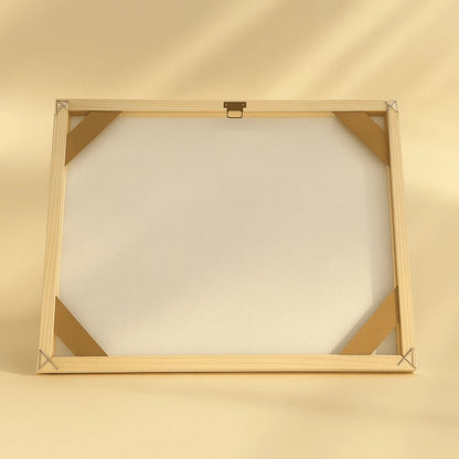 Wooden picture frame on a beige background