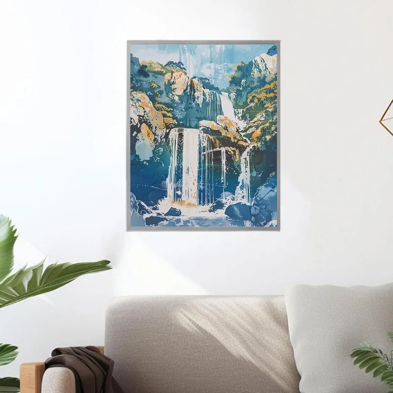 Framed artwork of a waterfall on a wall above a sofa