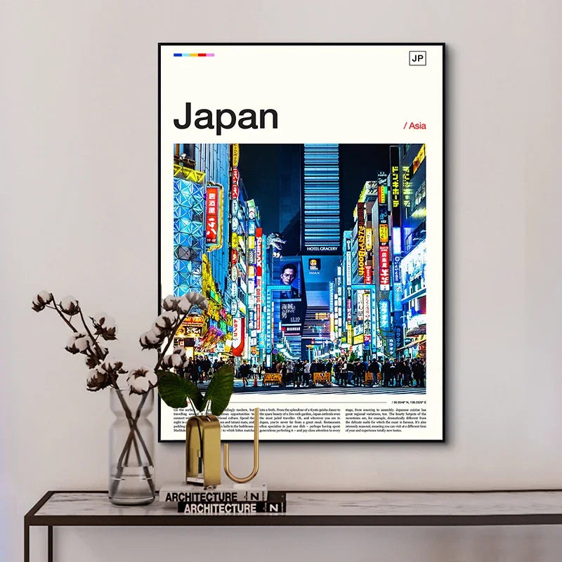 Framed poster of a cityscape at night with colorful lights, displayed on a wall above a table.