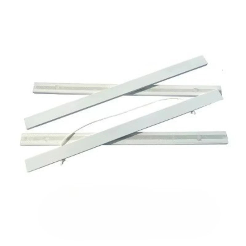 Three white plastic strips on a white background