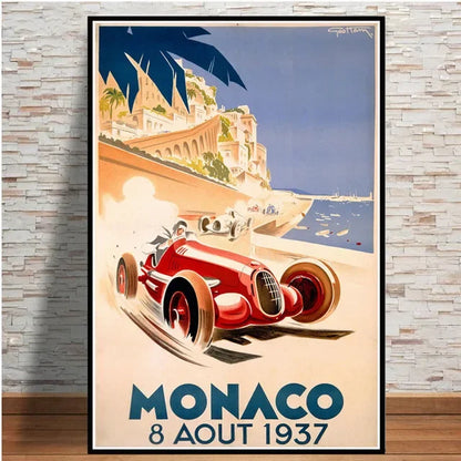 Vintage-style poster of a red race car on a beach with 'Monaco 8 Aout 1937' text, framed against a stone wall.
