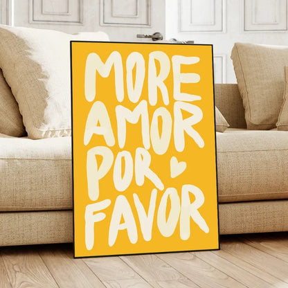 Yellow sign with white text 'MORE AMOR POR FAVOR' in a living room setting.