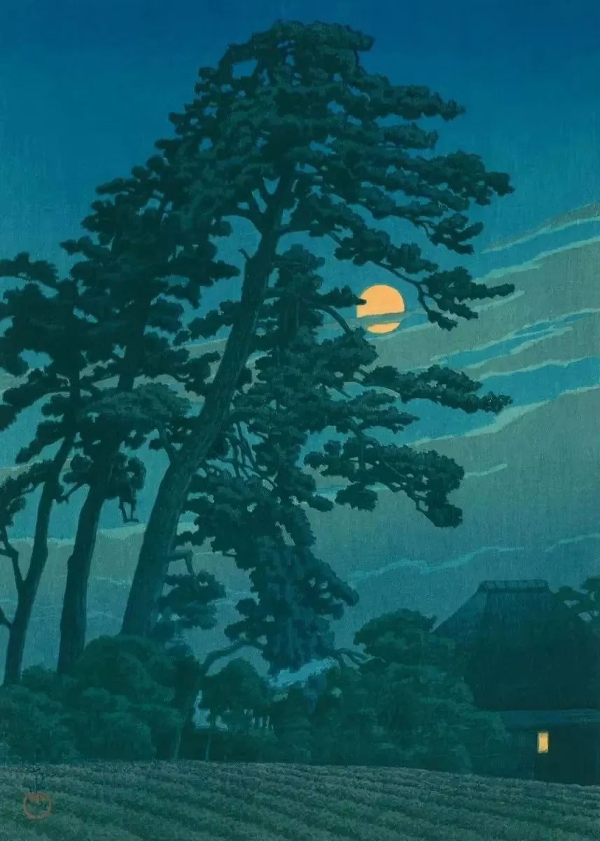 Silhouette of a large tree with a moonlit sky and traditional building in the background