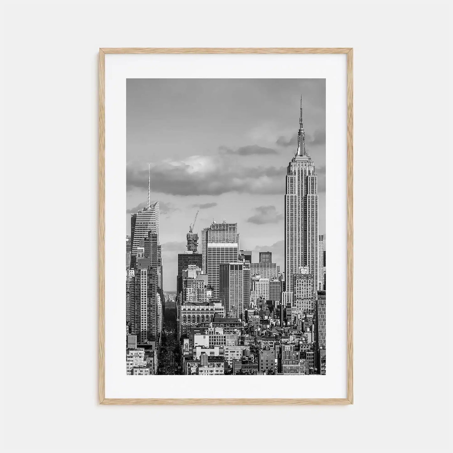 Framed black and white cityscape print with the Empire State Building on a light gray background