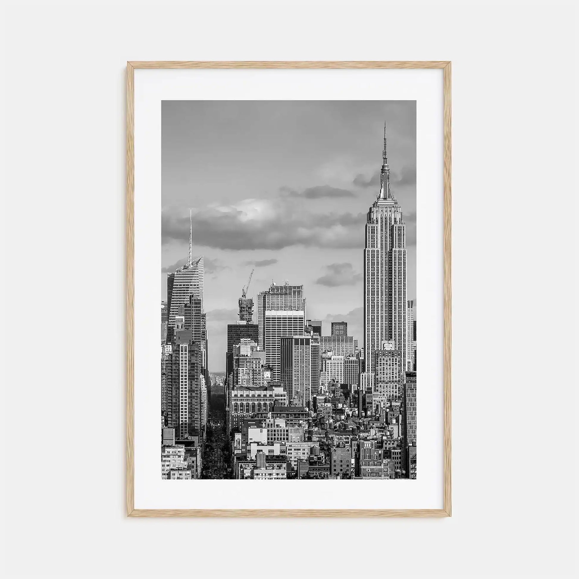 Framed black and white cityscape print with the Empire State Building on a light gray background