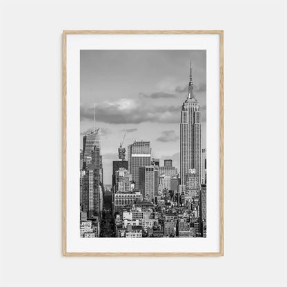 Framed black and white cityscape print with the Empire State Building on a light gray background