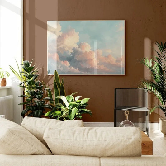 Living room with a beige sofa, plants, and a painting of clouds on a brown wall. Canvas & Curio