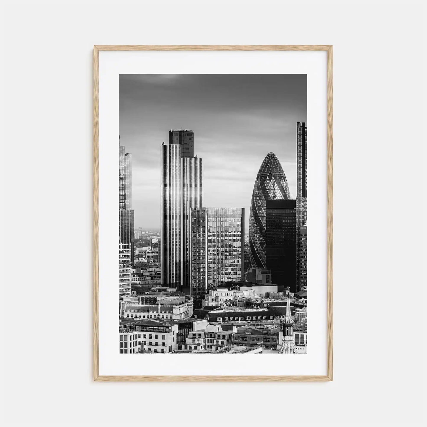 Framed black and white cityscape print with modern skyscrapers on a light gray background