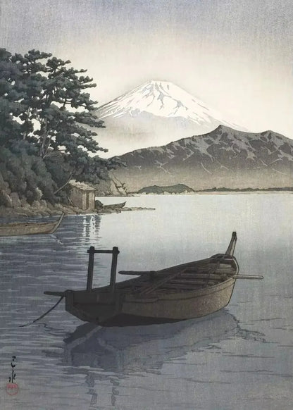 Traditional Japanese woodblock print of a boat on a lake with Mount Fuji in the background