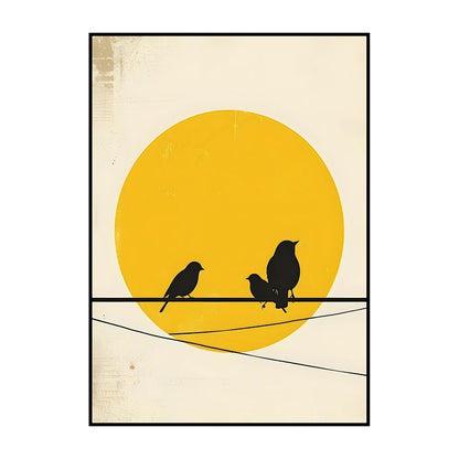 Framed artwork with three black birds on a wire against a yellow sun background