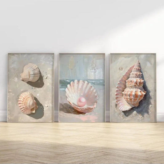Three framed artworks featuring seashells and pearls on a wooden surface. Canvas & Curio