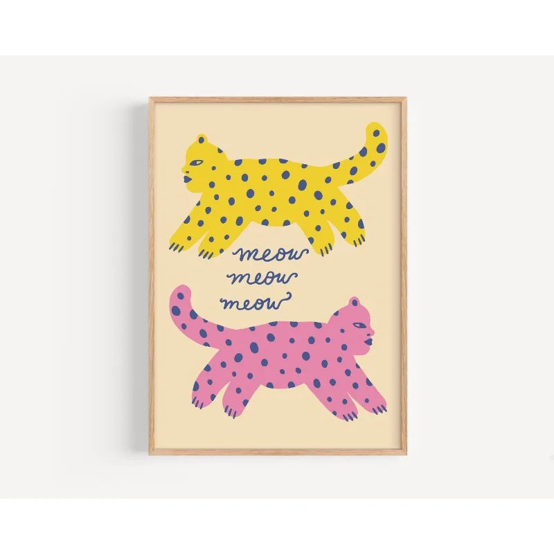 Framed artwork with two polka-dotted cats and 'meow meow meow' text on a beige background