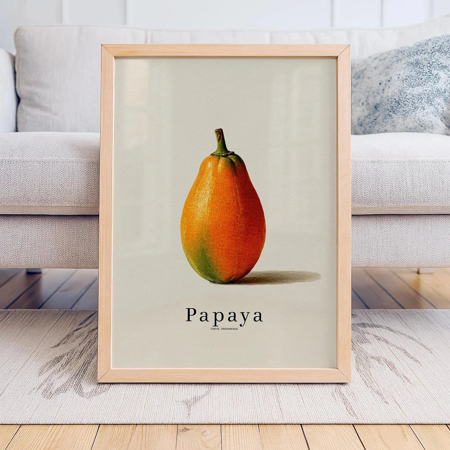 Framed print of a papaya on a neutral background