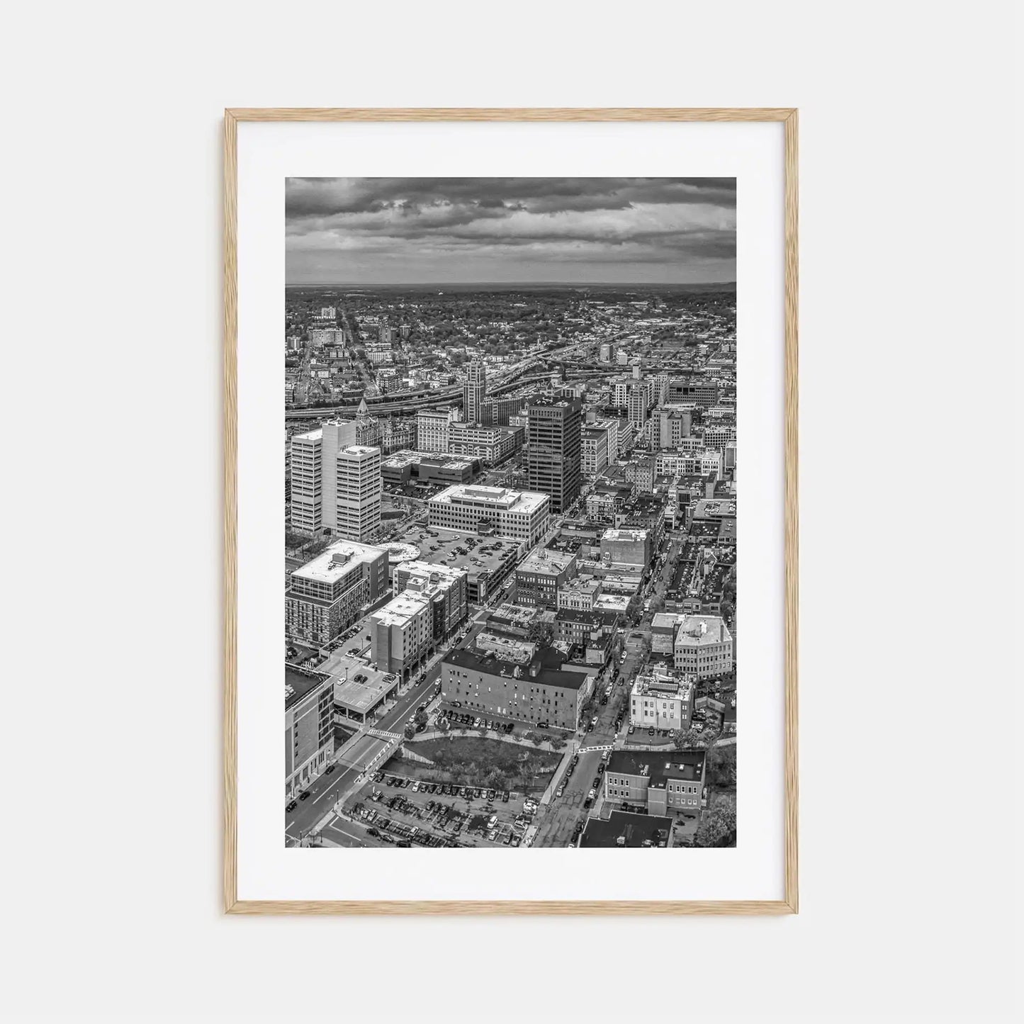 Framed black and white cityscape print on a light gray background