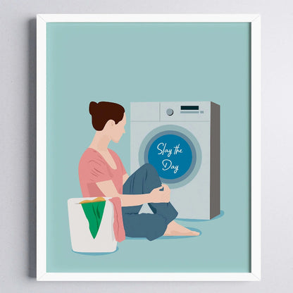 Illustration of a woman sitting next to a washing machine with 'Slay the Day' text on a light blue background.