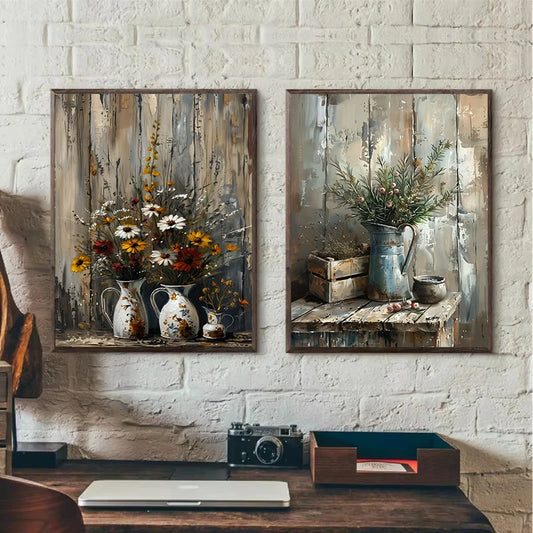 Two framed paintings of floral arrangements on a white brick wall. Canvas & Curio