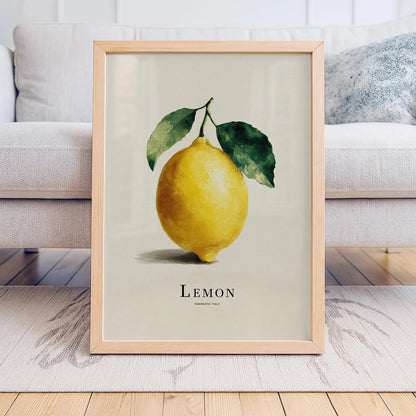 Framed artwork of a lemon with leaves on a neutral background