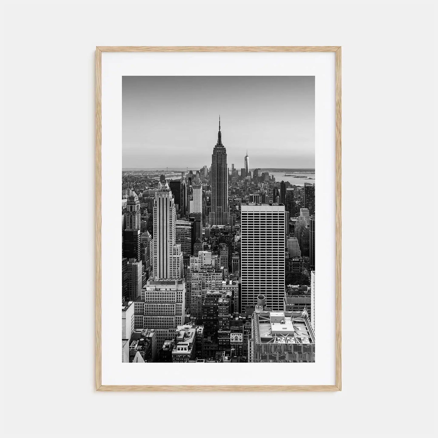 Framed black and white cityscape print of a skyline with the Empire State Building.