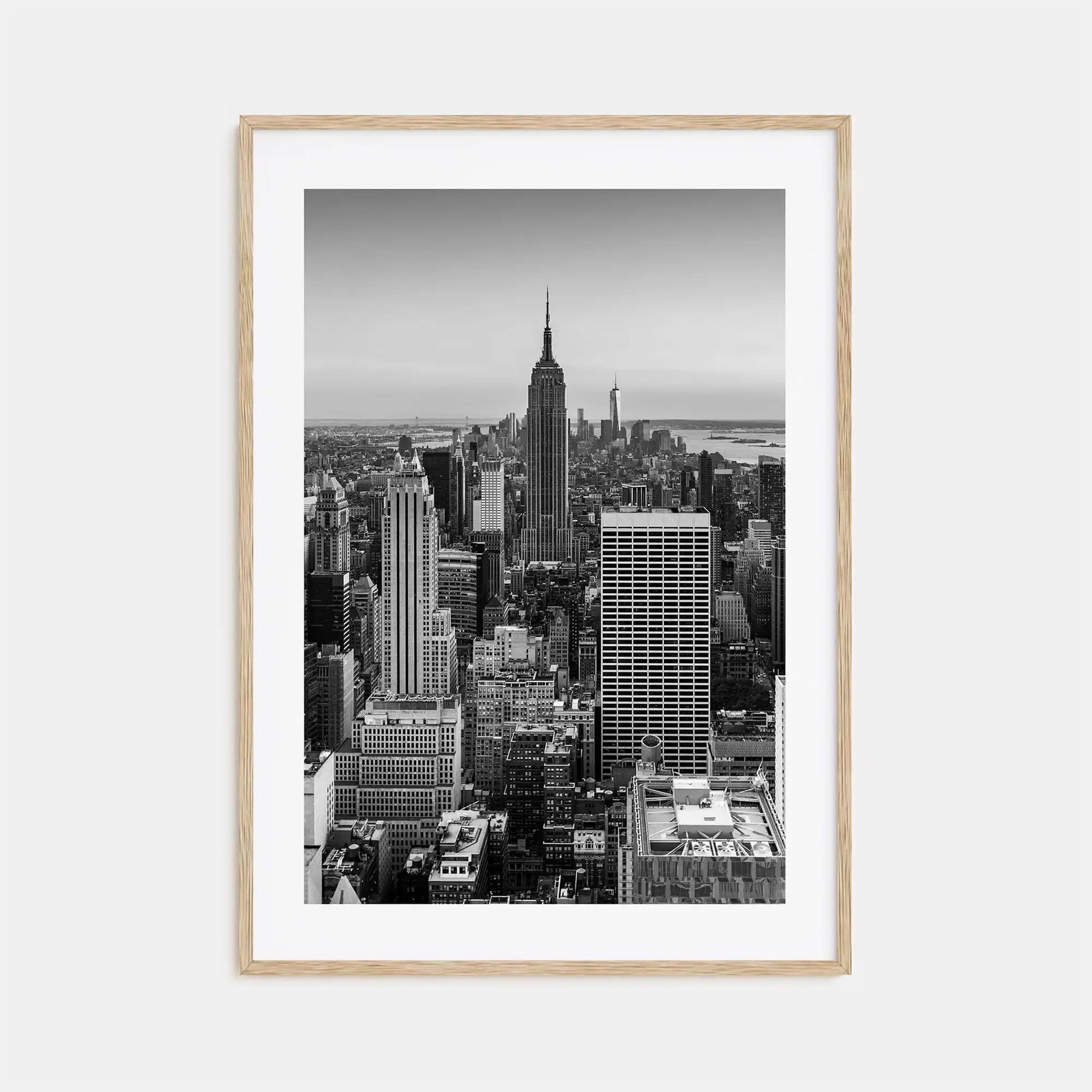 Framed black and white cityscape print of a skyline with the Empire State Building.