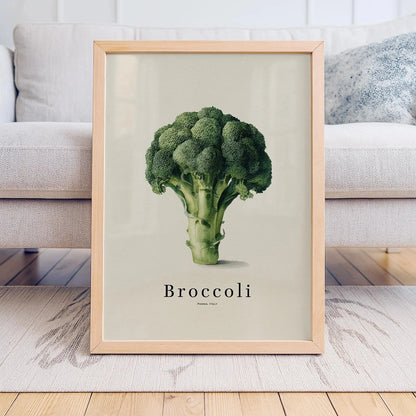 Framed poster of a broccoli on a light background in a living room setting.