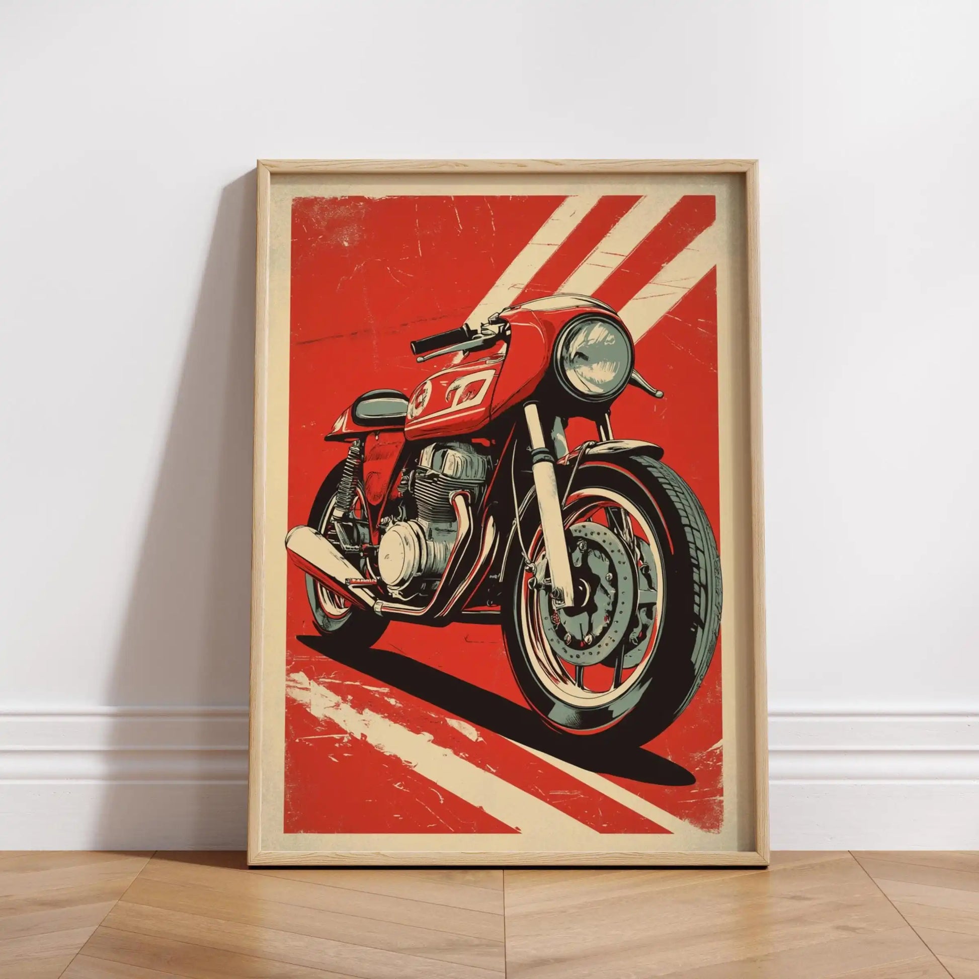 Framed poster of a red motorcycle on a red background with white stripes, leaning against a white wall.