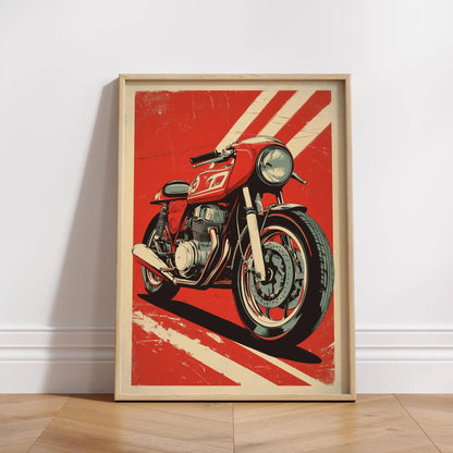 Framed poster of a red motorcycle on a red background with white stripes, leaning against a white wall.