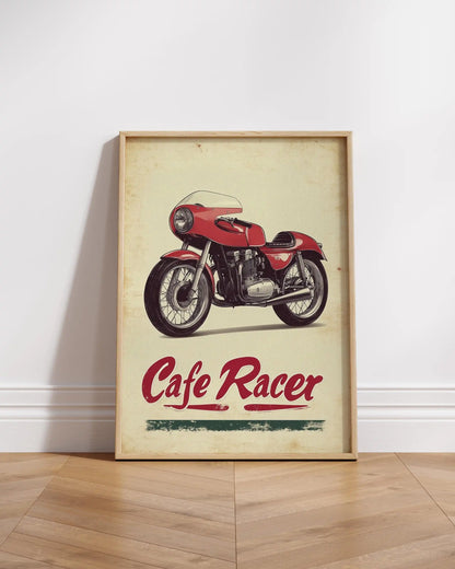 Framed poster of a red cafe racer motorcycle on a wooden floor.