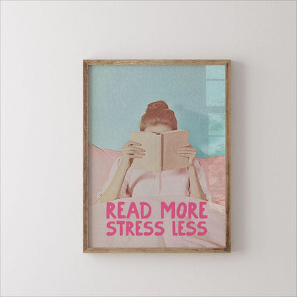 Framed artwork with a person reading a book and 'Read More Stress Less' text on a light background