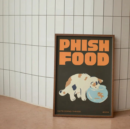 Framed poster with 'Phish Food' text and a cat illustration on a tiled wall.