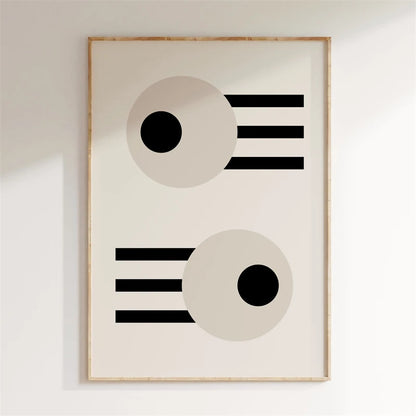 Framed abstract art with geometric shapes on a white wall