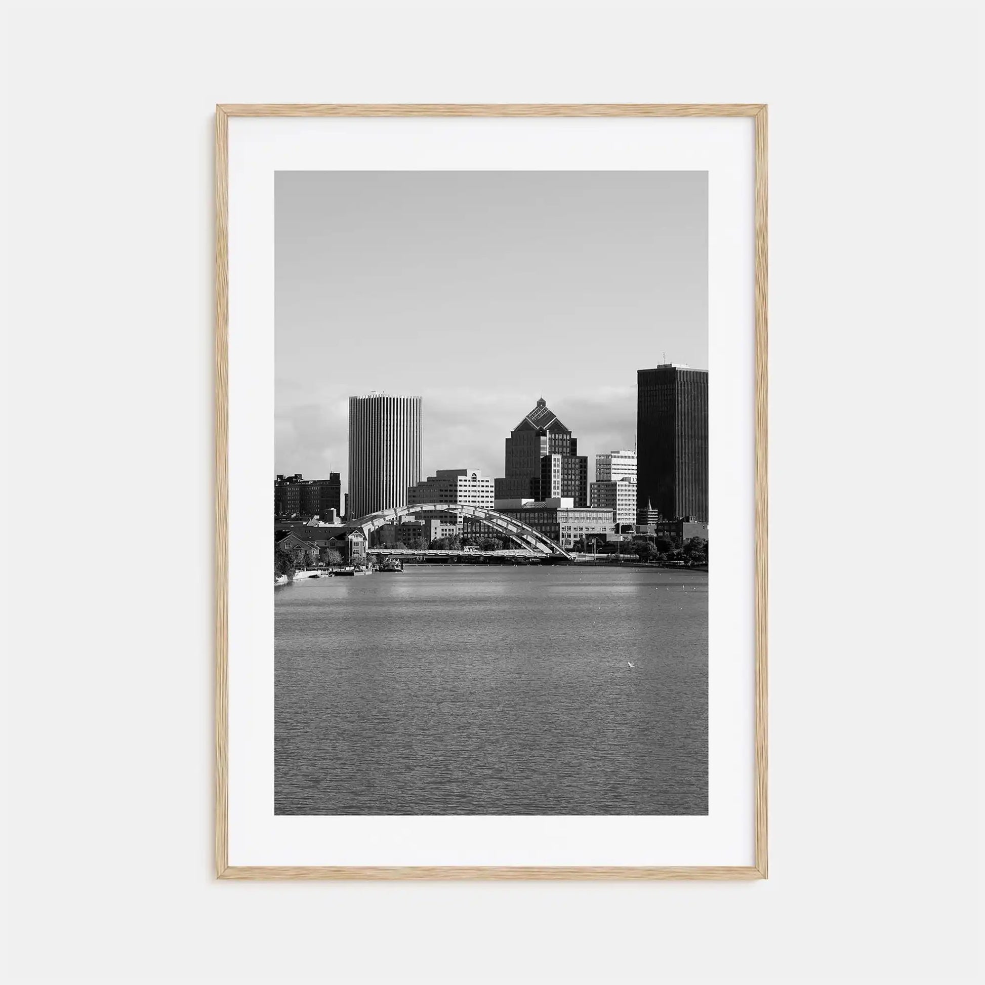 Framed black and white cityscape print with a river and skyline.