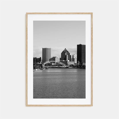 Framed black and white cityscape print with a river and skyline.
