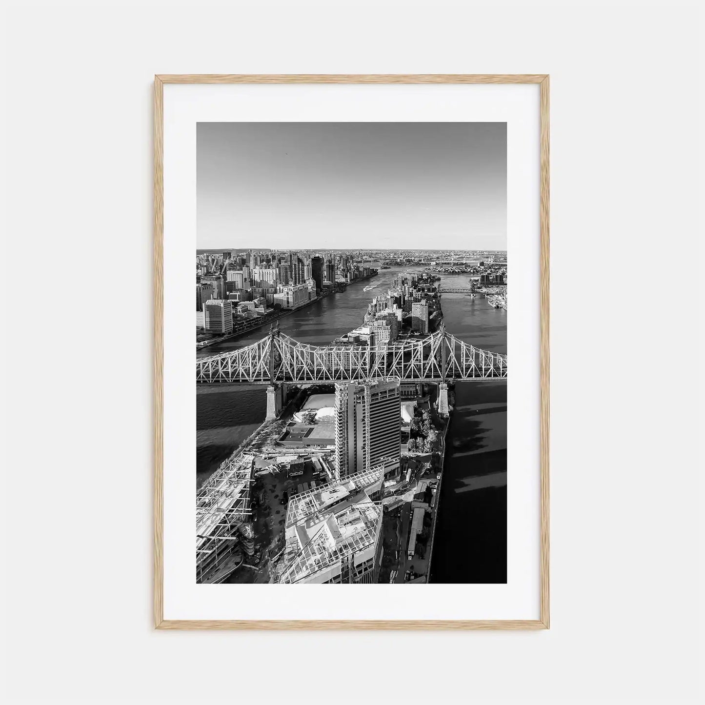 Framed black and white cityscape print with a bridge and skyline.