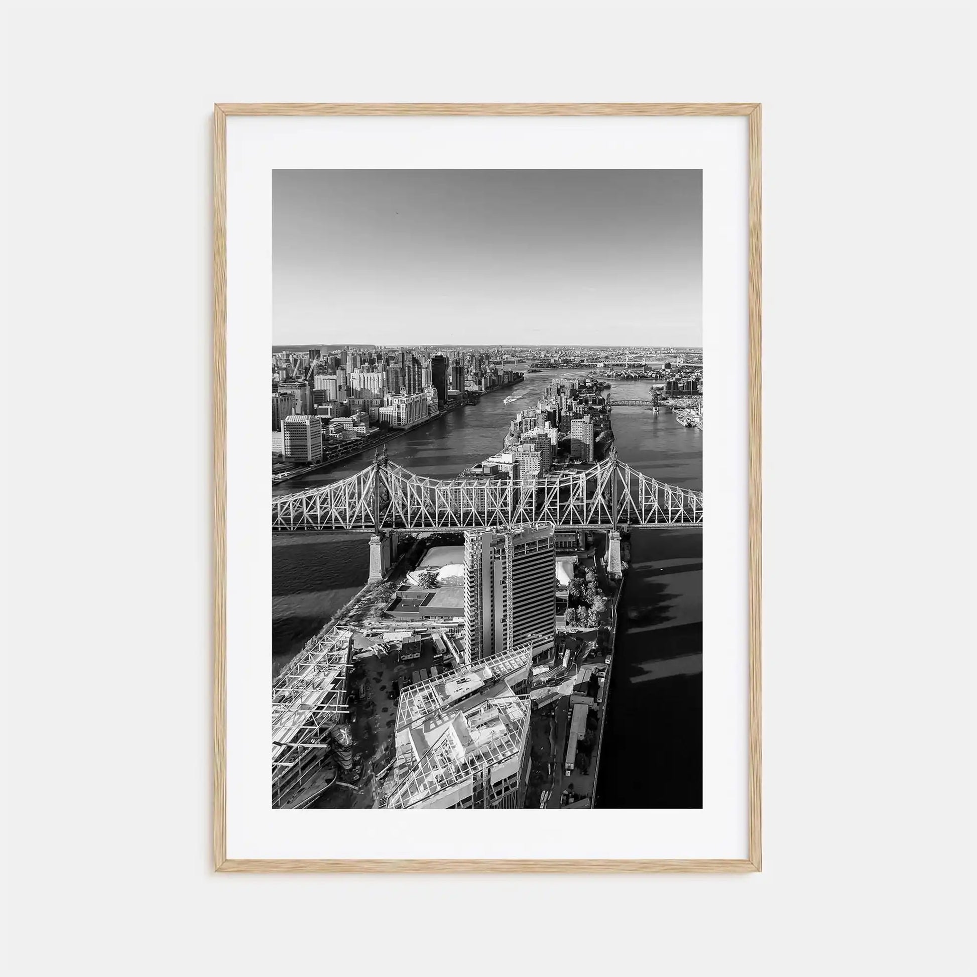Framed black and white cityscape print with a bridge and skyline.