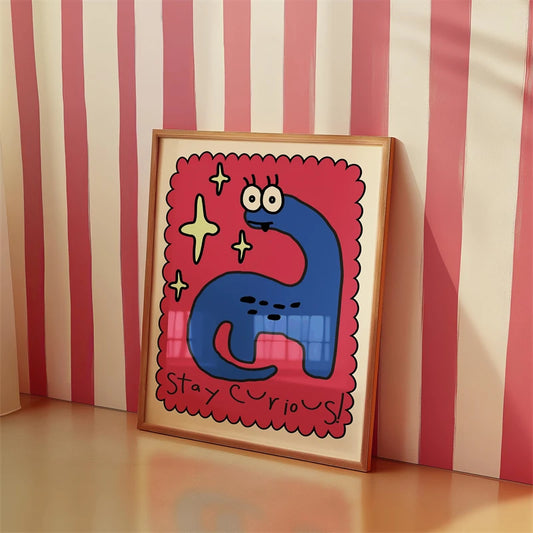 Framed artwork with a blue creature and stars on a red background against a striped wall. Canvas & Curio