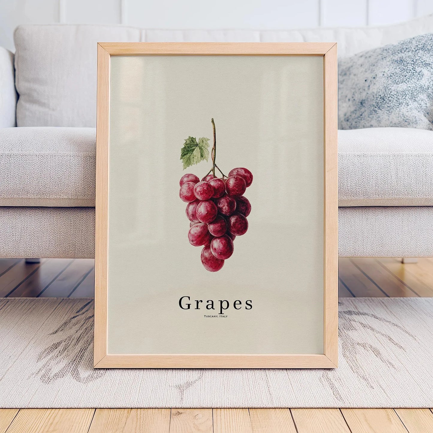 Framed print of grapes on a neutral background
