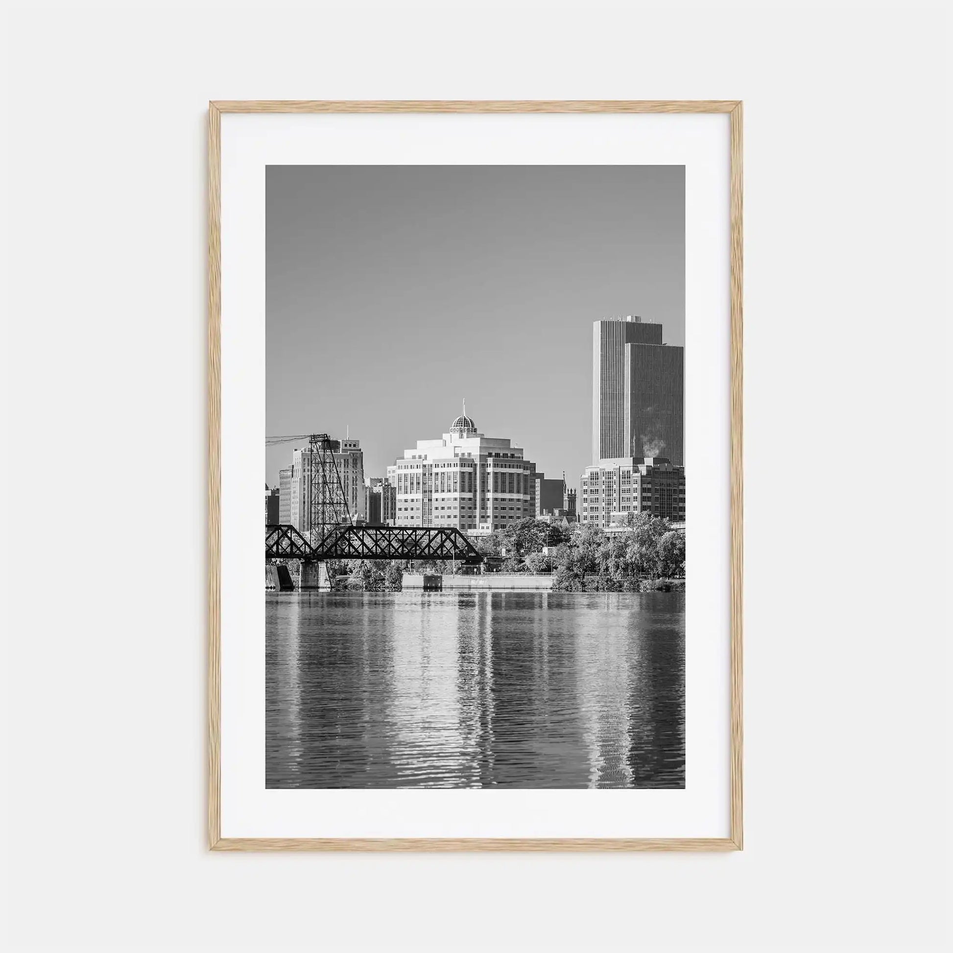 Framed black and white cityscape print with a river and skyline.