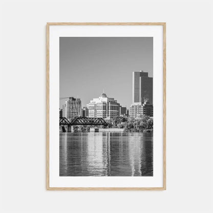 Framed black and white cityscape print with a river and skyline.