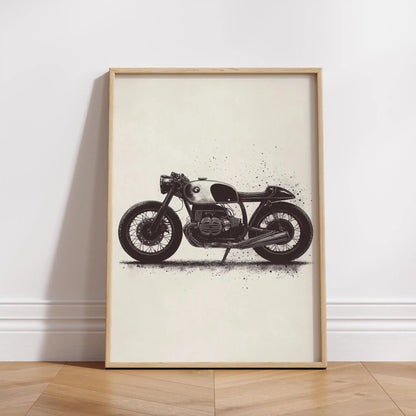 Framed artwork of a motorcycle on a white wall