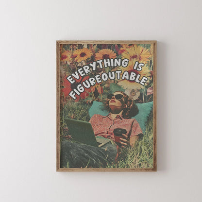 Framed artwork with a person sitting in grass, holding a laptop and coffee, and text 'EVERYTHING IS FIGUREOUTABLE'.