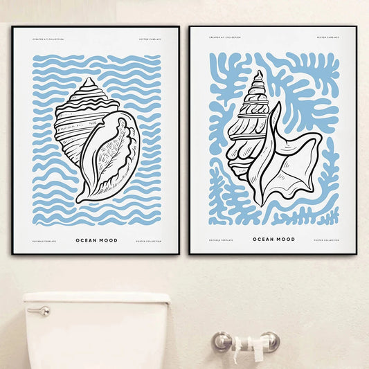 Two framed wall art prints of seashells with wavy patterns on a beige wall. Canvas & Curio