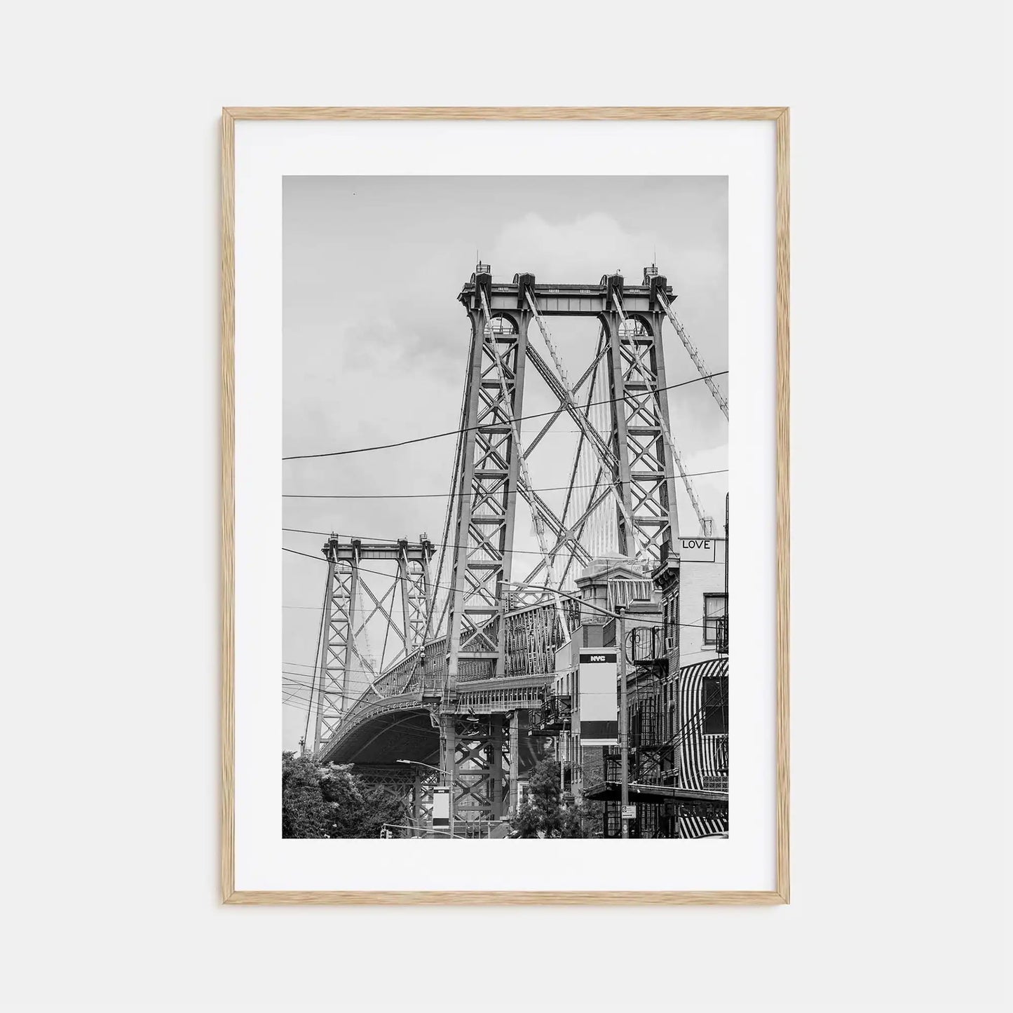 Framed black and white photograph of a bridge on a white background