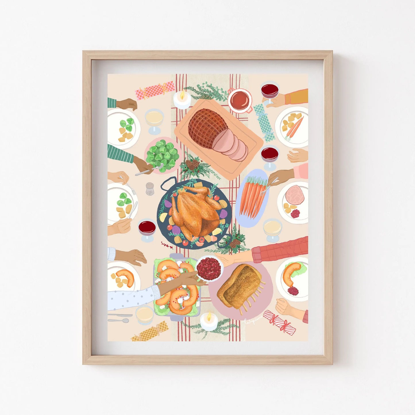 Framed artwork of a festive meal with various dishes on a table.
