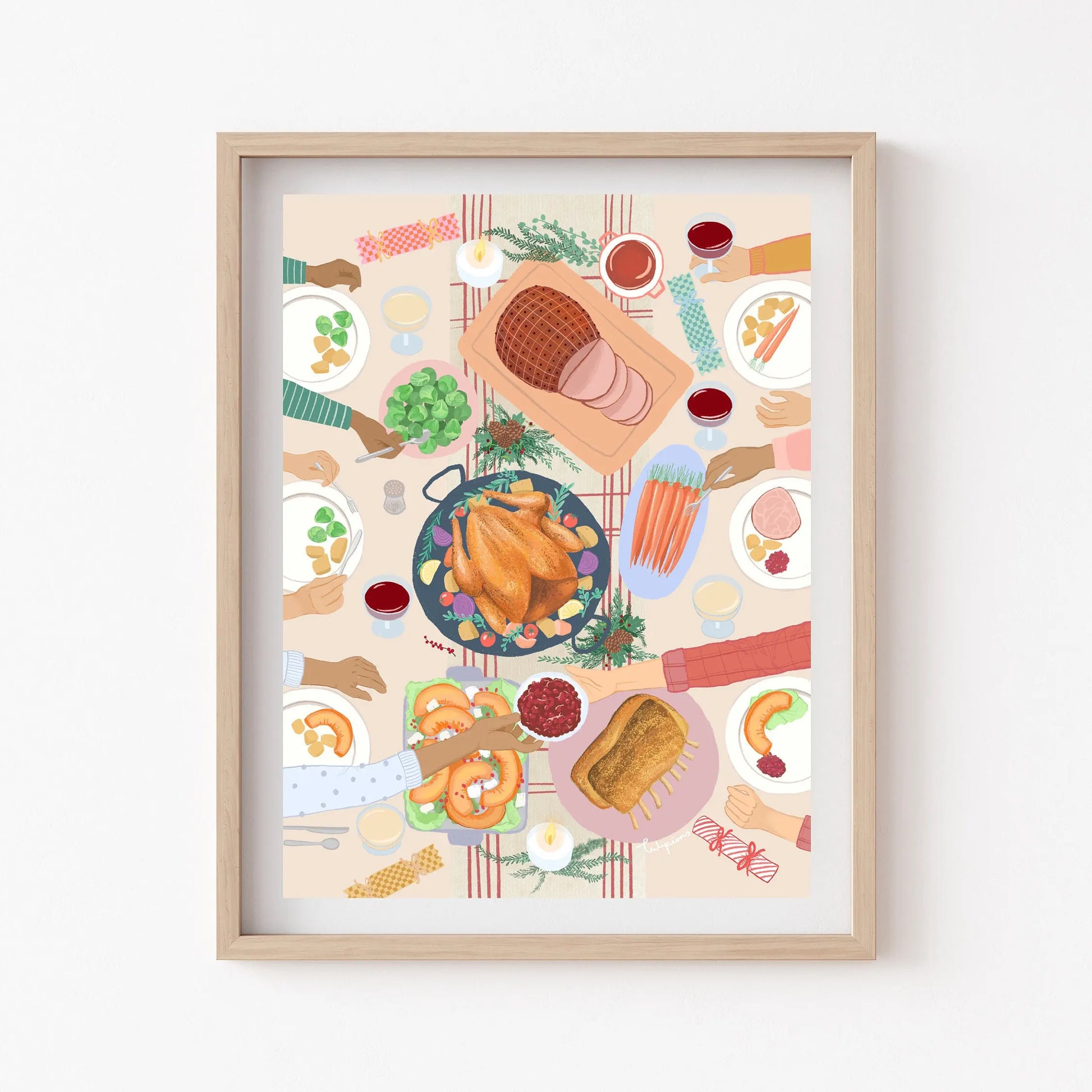 Framed artwork of a festive meal with various dishes on a table.