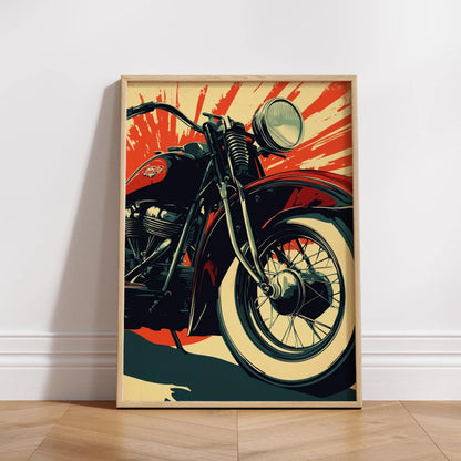 Framed poster of a motorcycle with a red and orange abstract background on a white wall.
